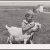 One of Mr. Browning's sons with his pet goat. They are FSA (Farm Security Administration) rehabilitation clients living on the Vale-Owyhee project. Dead Ox Flat, Malheur County, Oregon