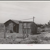 Chicken house and shed on the farm of the Schroeder family, FSA (Farm Security Administration) rehabilitation borrowers living on Dead Ox Flat. Vale-Owyhee irrigation project, Malheur County, Oregon