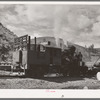 Locomotive of logging train. Baker County, Oregon. There has been a tendency to change from the logging train to trucks to transport logs to mills during recent years