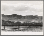 Fields extending into the mountains. Henefer, Utah. Mormon farmers in this section not only practice irrigation but take advantage of as much of all natural runoff from the mountains as possible