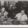 Mrs. Browning and her daughter eating dinner. This family does much canning in line with FSA (Farm Security Administration) live at home program. They are FSA rehabilitation borrowers at Dead Ox Flat, Malheur County, Oregon