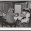 The Browning family says grace before dinner. Mr. Browning is a FSA (Farm Security Administration) rehabilitation borrower living at Dead Ox Flat, Malheur County, Oregon