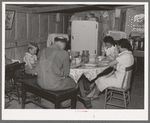 The Browning family says grace before dinner. Mr. Browning is a FSA (Farm Security Administration) rehabilitation borrower living at Dead Ox Flat, Malheur County, Oregon