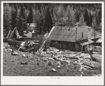 Bourne, Oregon. Crumbling buildings in a ghost mining town. The town came into existence in the 1870s and was notorious for the wildcat venture. Exodus from the camp occured in 1906 and most of the mines have remained closed. In the 1940 Oregon state