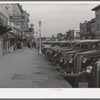 Main street of Twin Falls, Idaho. Among industries in this town are a sugar beet factory, cannery and it is a shipping center for potatoes and onions