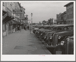 Main street of Twin Falls, Idaho. Among industries in this town are a sugar beet factory, cannery and it is a shipping center for potatoes and onions