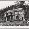 Abandoned house which was headquarters of wildcat mining organization in 1906. Bourne, Oregon