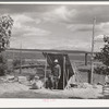 Basement house of Mrs. White, FSA (Farm Security Administration) rehabilitation borrower. Dead Ox Flat. Many of these basement houses are seen on the Owyhee Irrigation Project and after about five years on the land, the farmers are generally in a position