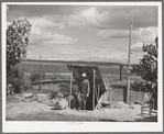Basement house of Mrs. White, FSA (Farm Security Administration) rehabilitation borrower. Dead Ox Flat. Many of these basement houses are seen on the Owyhee Irrigation Project and after about five years on the land, the farmers are generally in a position