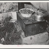 Cook stove in tent home of young farmer and his wife. Vale-Owyhee irrigation project, Malheur County, Oregon. This is first year on this land, in fact, they had been here only two months. This year they will devote time, energy, and money to getting their