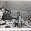 Sheep shearers eating dinner in central tent. Ranch in Malheur County, Oregon. The wife of the owner and boss of the outfit does the kraut and ham, dried beans, canned tomatoes, potatoes, pudding, jams and jellies, coffee and tea