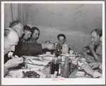 Sheep shearers eating dinner in central tent. Ranch in Malheur County, Oregon. The wife of the owner and boss of the outfit does the kraut and ham, dried beans, canned tomatoes, potatoes, pudding, jams and jellies, coffee and tea