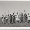 Flag drill for entertainment at end of school term at the FSA (Farm Security Administration) camp for farm workers. Caldwell, Idaho