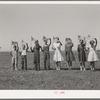 Flag drill for entertainment at end of school term at the FSA (Farm Security Administration) camp for farm workers. Caldwell, Idaho