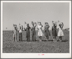 Flag drill for entertainment at end of school term at the FSA (Farm Security Administration) camp for farm workers. Caldwell, Idaho