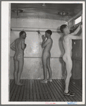 Showers at the FSA (Farm Security Administration) migratory labor camp mobile unit. Wilder, Idaho. There is no one thing that the migratory farm workers appreciate more at the camps, both permanent and mobile, than the hot water for bathing and laundry