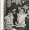 Schoolchildren and their mothers looking at handwork at the 4-H Club Spring fair. Adrian, Oregon