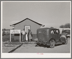 Newly-arrived farm workers talking to the Idaho state employment representative at the FSA (Farm Security Administration) migratory labor camp mobile unit. Wilder, Idaho