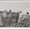 Nurse with group of farm workers as she makes her calls in the afternoon. FSA (Farm Security Administration) migratory labor camp mobile unit. Wilder, Idaho