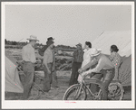 Nurse with group of farm workers as she makes her calls in the afternoon. FSA (Farm Security Administration) migratory labor camp mobile unit. Wilder, Idaho