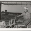 The nurse does her laundry at the FSA (Farm Security Administration) migratory labor camp mobile unit. Wilder, Idaho