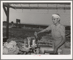 The nurse does her laundry at the FSA (Farm Security Administration) migratory labor camp mobile unit. Wilder, Idaho