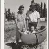 Farm worker with his wife and their twin babies at the FSA (Farm Security Administration) migratory labor camp mobile unit. Wilder, Idaho