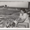 Laundry at the FSA (Farm Security Administration) migratory labor camp mobile unit. Wilder, Idaho. Power for the entire camp is furnished by a portable generator unit