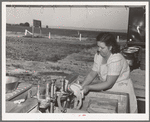 Laundry at the FSA (Farm Security Administration) migratory labor camp mobile unit. Wilder, Idaho. Power for the entire camp is furnished by a portable generator unit