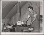 Farm worker's wife prepares dinner. FSA (Farm Security Administration) migratory labor camp mobile unit. Wilder, Idaho