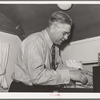 Clerk at the FSA (Farm Security Administration) migratory labor camp mobile unit. Wilder, Idaho