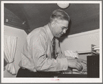 Clerk at the FSA (Farm Security Administration) migratory labor camp mobile unit. Wilder, Idaho