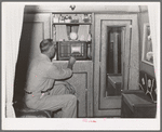 Construction worker in his trailer home. San Diego, California