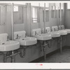 Washbasins at the FSA (Farm Security Administration) trailer camp for defense workers. San Diego, California