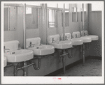 Washbasins at the FSA (Farm Security Administration) trailer camp for defense workers. San Diego, California