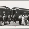 These four photographs were taken at the railroad station when a noon train came in. All trains coming into San Diego are crowded and are an indication of the hordes of people pouring into the city. California