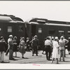 These four photographs were taken at the railroad station when a noon train came in. All trains coming into San Diego are crowded and are an indication of the hordes of people pouring into the city. California