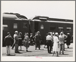 These four photographs were taken at the railroad station when a noon train came in. All trains coming into San Diego are crowded and are an indication of the hordes of people pouring into the city. California