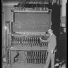 Unidentified man with lighting switches and dimmers, backstage at the production Spring and Autumn