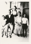 Lawrence Reddick (right), approximately 10 years old, with his parents and siblings outside a house in Jacksonville, Florida