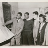 Lawrence D. Reddick discussing a map of Africa with four visiting City College of New York students