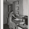 Wife of farm worker in kitchen of her cottage. Her husband is a "permanent" farm worker and they live in one of the cottages at the FSA (Farm Security Administration) labor camp. Caldwell, Idaho