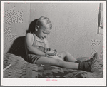 Little boy, son of farm worker, in his home at the FSA (Farm Security Administration) labor camp. Caldwell, Idaho