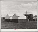 Nampa, Idaho. Mobile unit of the FSA (Farm Security Administration) camp for migratory farm workers. Tents of staff members and the power unit in the background