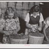 "Dressing" crates of peas for shipment. Canyon County, Idaho