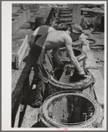 Making irrigation tile. Canyon County, Idaho