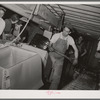 Icing crates of lettuce for shipment. Canyon County, Idaho