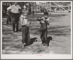 The boy who caught the greased pig at the Fourth of July celebration at Vale, Oregon. The little boy who caught the pig says he's going to join the 4-H Club so he can learn how to feed his pig properly