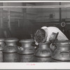 Tester smelling cream to determine its freshness. Dairymen's Cooperative Creamery, Caldwell, Canyon County, Idaho