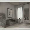 Corner of new Myrbor salons, three of walls in hyacinth blue, fourth in buff. Note unique molding at ceiling, grey with odd pattern in bottle green. Panel screen, divan and table in sycamore. Rug designed by Jean Lurçat and edited by Myrbor in pattern